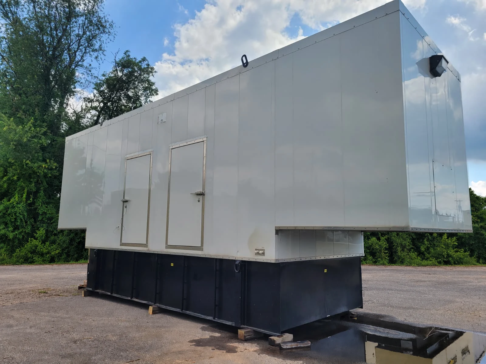 Enclosed CAT 800 kW generator with sub-base fuel tank