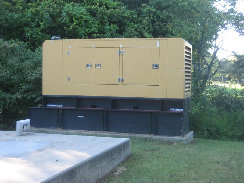 Caterpillar Olympian diesel generator in an outdoor enclosure